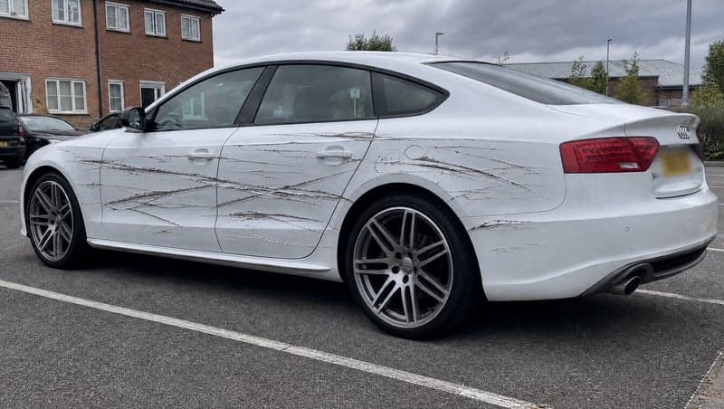 Before and after AI image of a completely totaled car used as a prank
